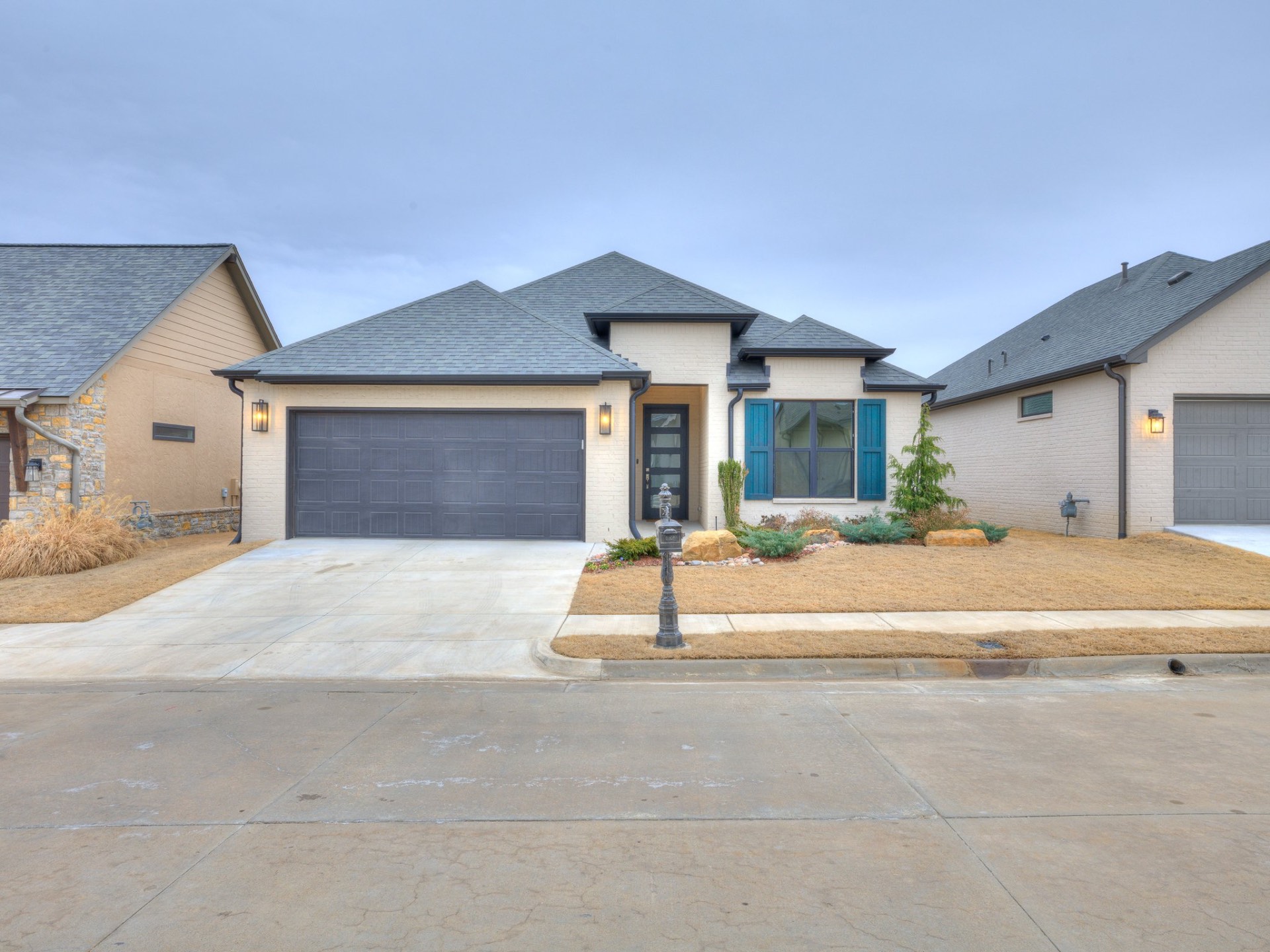 Modern cottage exterior with teal shutters